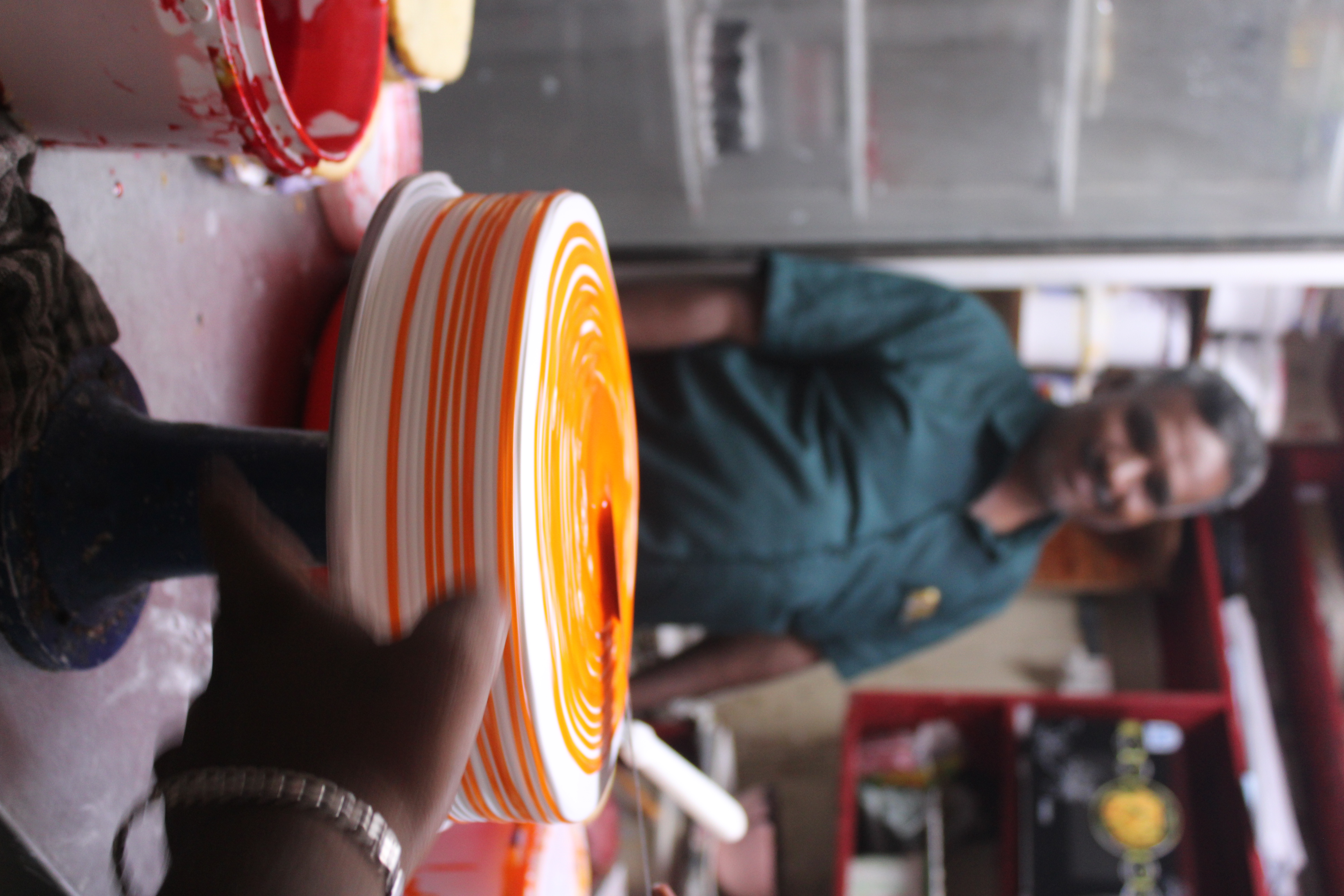 Baker crafting an orange cake